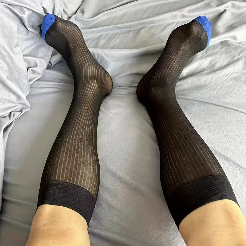 "Men’s luxury sheer dress socks in classic black with bold executive styling – The Regent by Eliot Grey Socks, inspired by London’s power and presence."