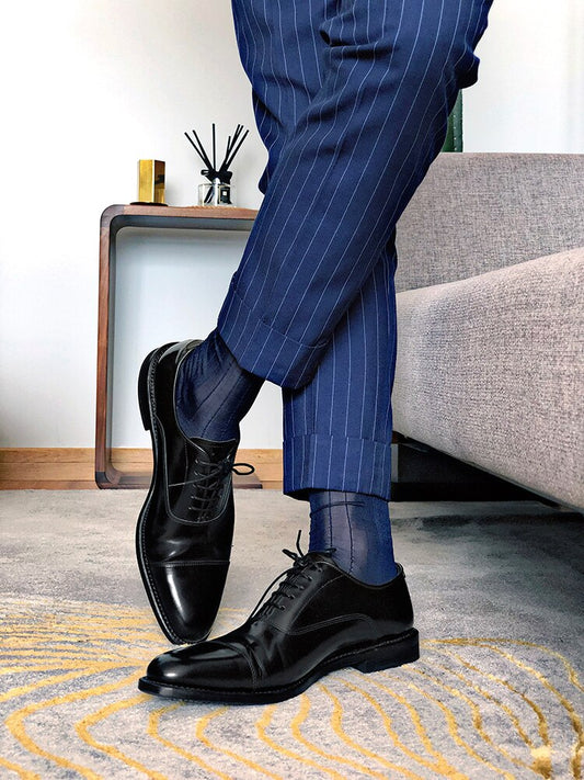 "Men’s luxury sheer dress socks in classic black with bold executive styling – The Regent by Eliot Grey Socks, inspired by London’s power and presence."